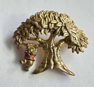 Pooh swinging under a big tree broach pin