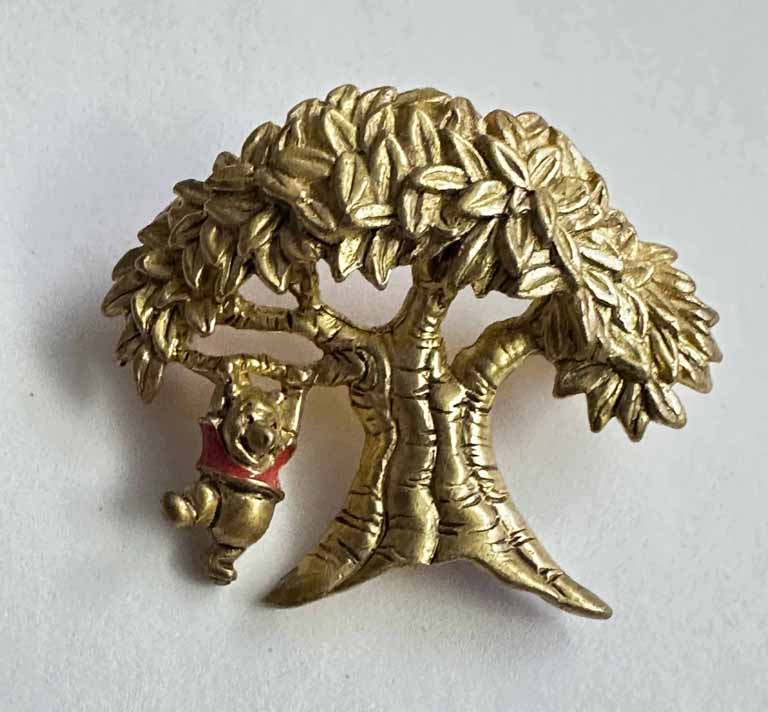 Pooh swinging under a big tree broach pin