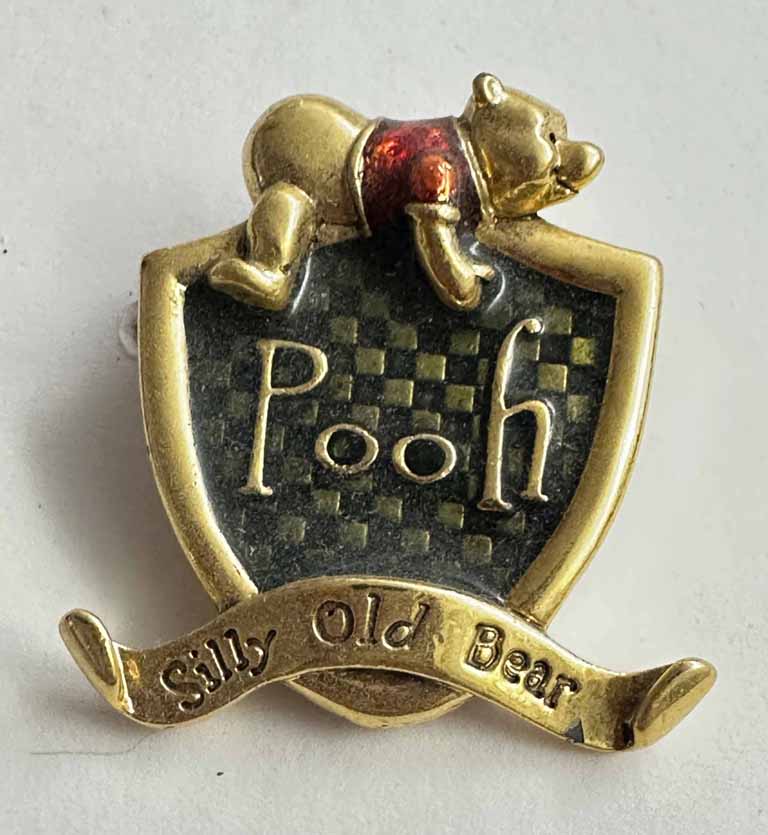 Pooh Sitting on shield broach pin