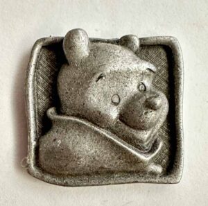 Winnie the Pooh peeking out pin
