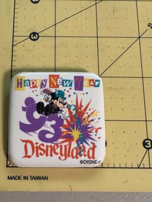 1993 Disneyland Happy New Year pinback button features Mickey Mouse celebrating with fireworks
