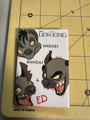 1994 rectangular button from Disney's The Lion King, featuring Shenzi, Banzai, and Ed