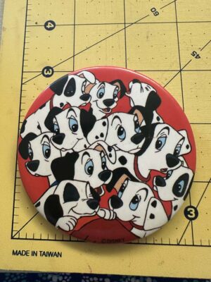 101 Dalmatians promo button featuring 11 puppies
