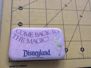 1990s Disneyland rectangular button featuring Tinker Bell Come Back to the Magic!