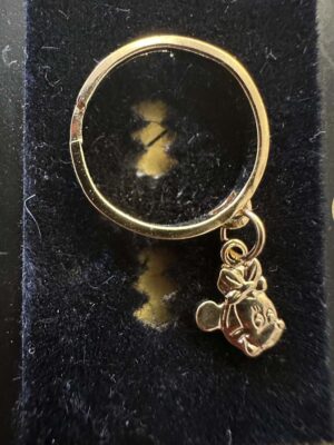 Minnie Mouse charm ring features her head dangling from a split band