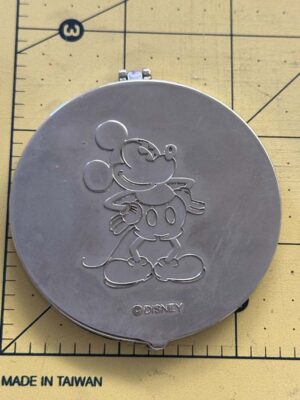 Silver-toned, circular Mickey Mouse compact mirror