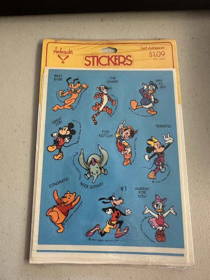 Vintage 1980s sheet of Ambassador brand stickers featuring various Walt Disney characters