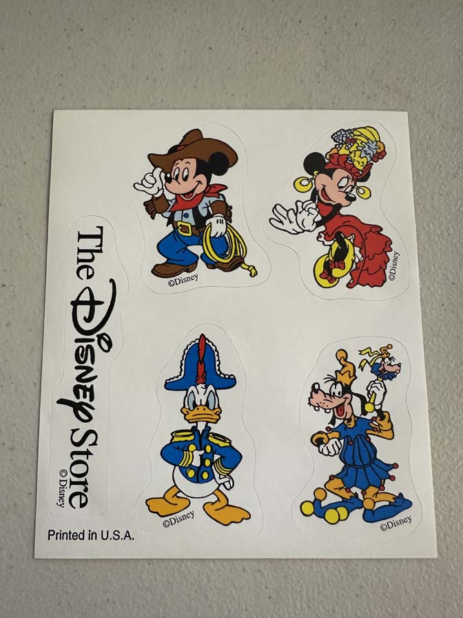 Sticker sheet featuring Disney characters in various themed outfits
