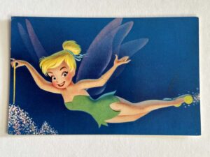 Vintage 1960s Walt Disney Productions souvenir postcard featuring Tinker Bell sprinkling pixie dust