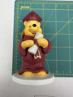 Winnie the Pooh ceramic figurine celebrating the graduation class of 1999.