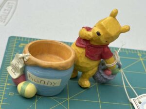 Classic Pooh featuring Winnie the Pooh with a honey pot