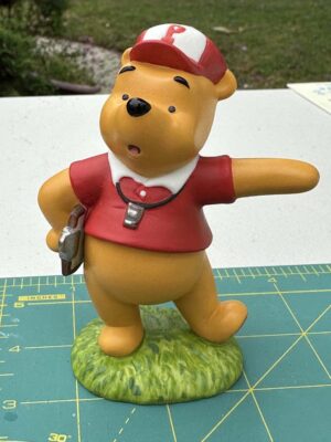 Disney Coach Winnie the Pooh collectible, standing approximately 3 inches tall