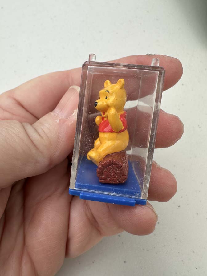 Winnie the Pooh collectible figure is encased in a clear plastic display box with a blue base - Image 2