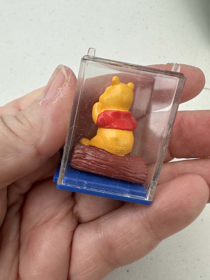 Winnie the Pooh collectible figure is encased in a clear plastic display box with a blue base - Image 3