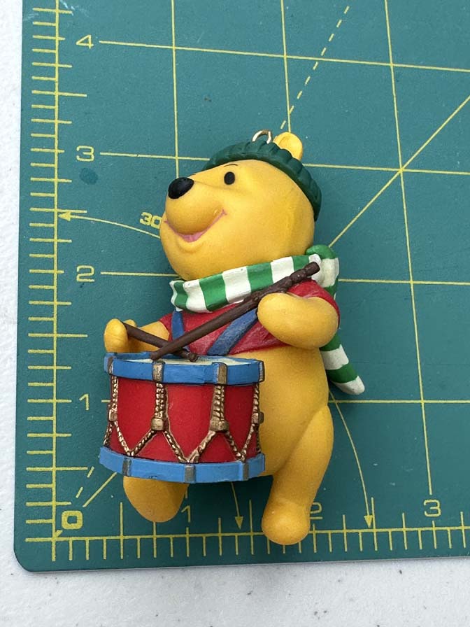 vintage Grolier Disney Christmas Magic ornament featuring Winnie the Pooh playing a drum. - Image 4