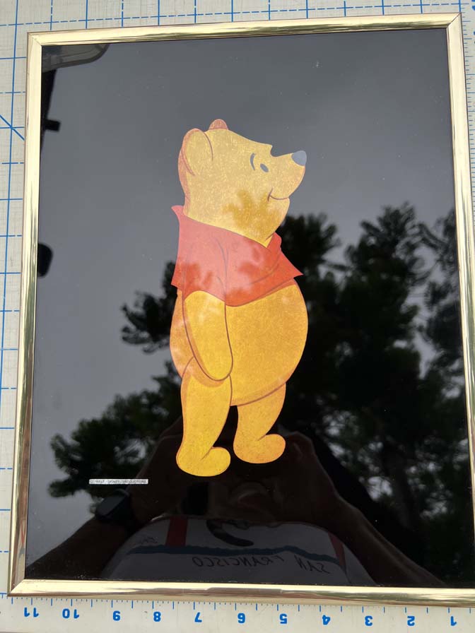 1980s Kafka Industries foil art print features Winnie the Pooh against a black background in a gold-tone frame