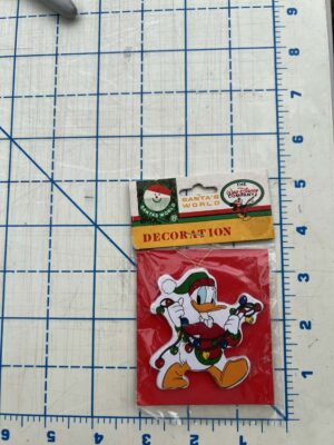 1980s Kurt Adler "Santa's World" wooden Disney Christmas ornament featuring Donald Duck