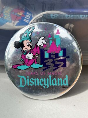 1990 Disneyland 35th anniversary "35 Years of Magic" button featuring holographic details and Sorcerer Mickey Mouse.