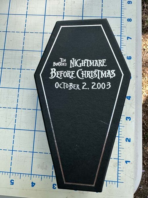 Nightmare Before Christmas themed gift set features items tucked into a black, coffin-shaped display box Oogie with Snowman Pin - Image 5