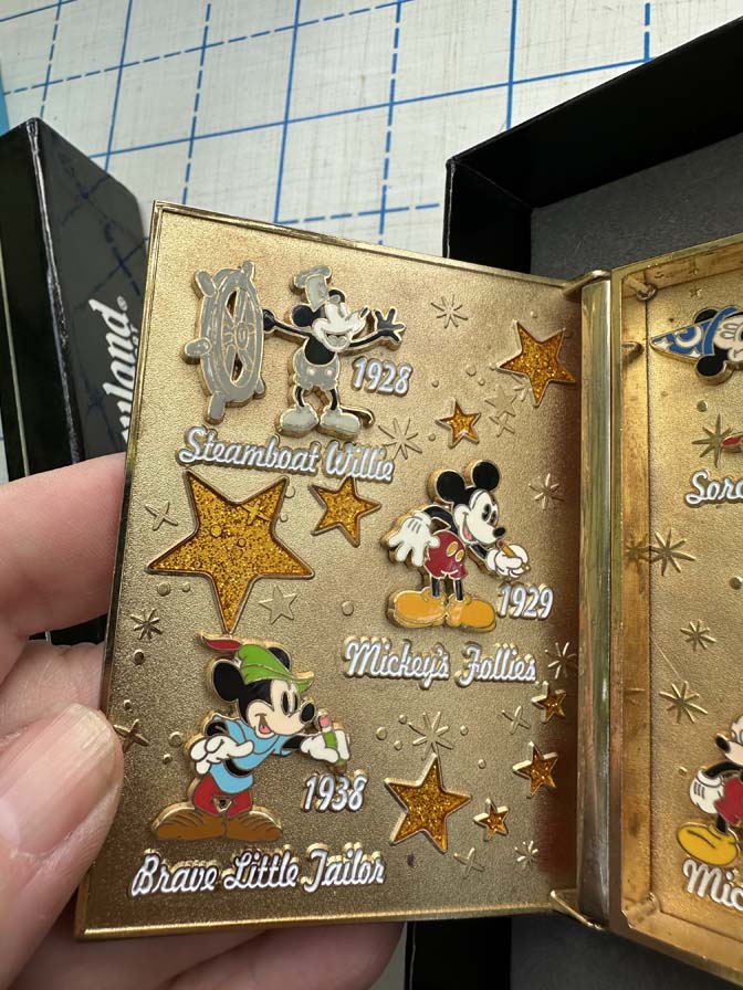 Jumbo pin "The Story of Mickey Mouse Through the Years," featuring Mickey and Minnie Mouse in a classic animation style - Image 2