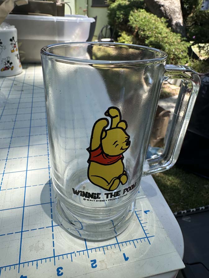 Walt Disney Productions Winnie the Pooh clear glass footed mug featuring the character sitting with his arms raised - Image 2