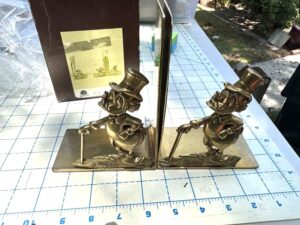 vintage Walt Disney Productions Scrooge McDuck bookends are crafted from solid brass