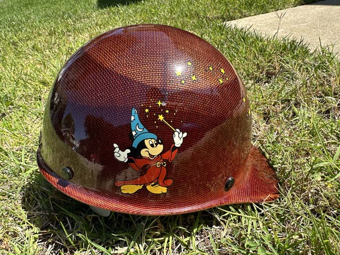 Walt Disney Imagineering (WDI) hard hat, JOE name specifically featuring a red carbon-fiber style finish and Sorcerer Mickey Mouse.