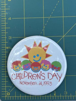 Walt Disney World Children's Day button from November 21 1993 features a colorful sun and children graphic