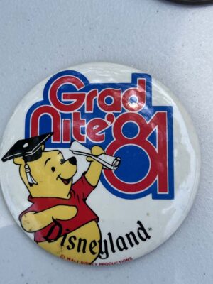 vintage 1981 Disneyland "Grad Nite" button featuring Winnie the Pooh in a graduation cap holding a diploma